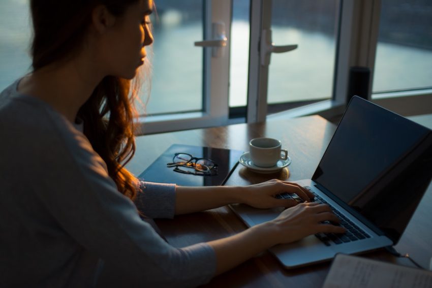 lady filing taxes with charitable tax receipts